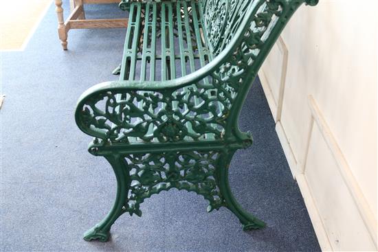 A Coalbrookdale Arabesque pattern cast iron green painted garden bench, W.122cm